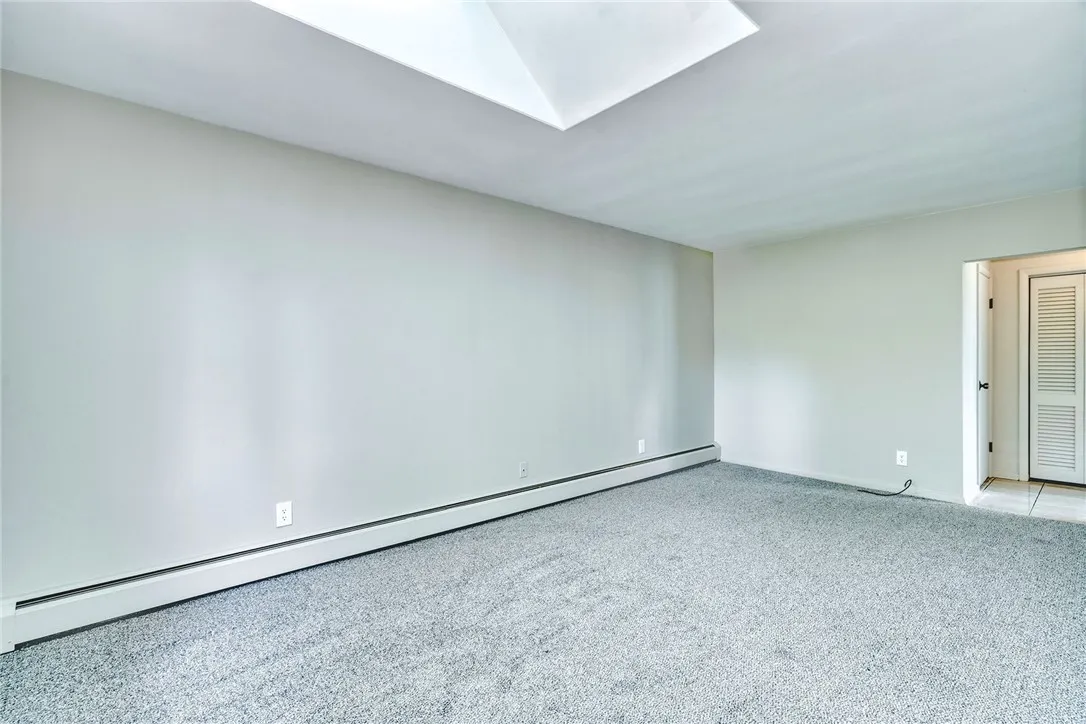 Short wall is approximately 7', adjacent to full bath and a perfect spot to build a double closet . . .