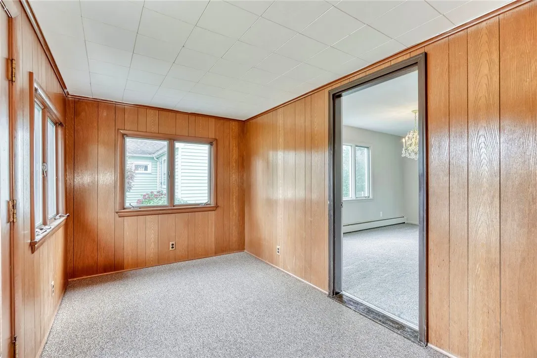 Enclosed front porch - view on right into the dining room . . .