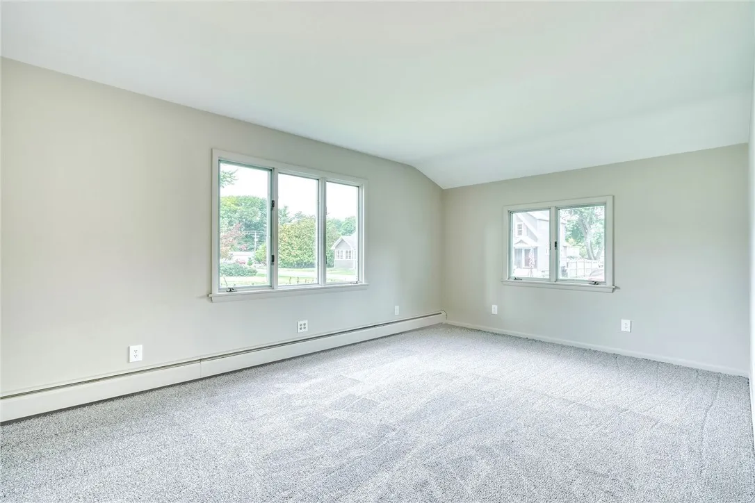 Very inviting large living room with loads of natural light