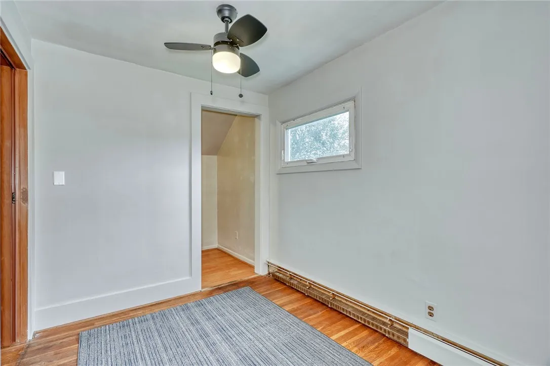 Bedroom, left of stairs with new ceiling fan.