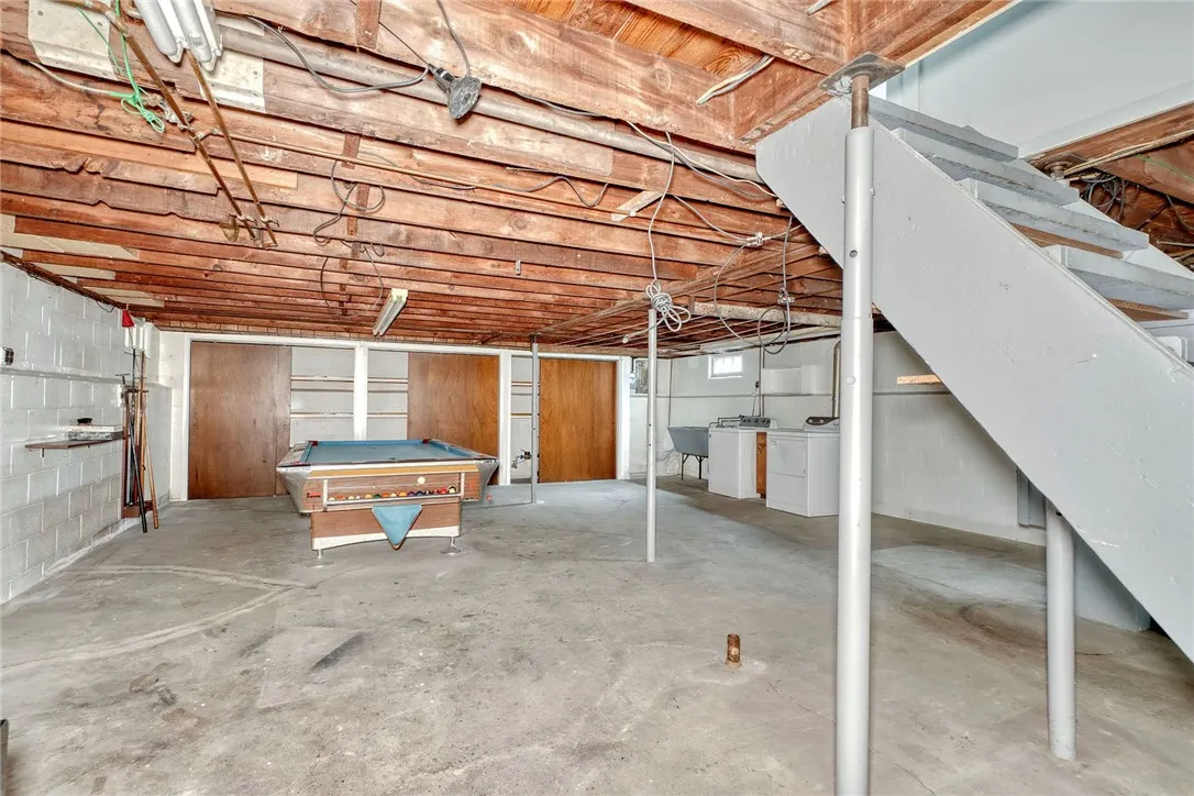 Laundry area with washtub and a commode (far back right corner)