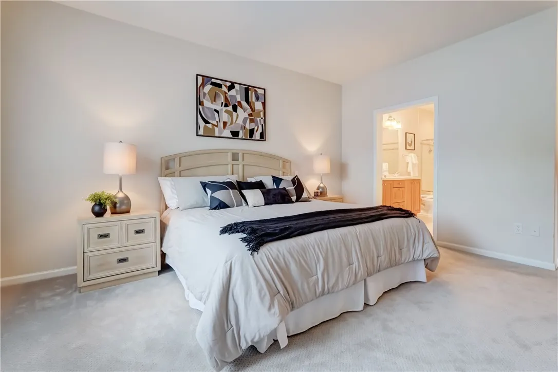 Primary bedroom looking toward attached bath.