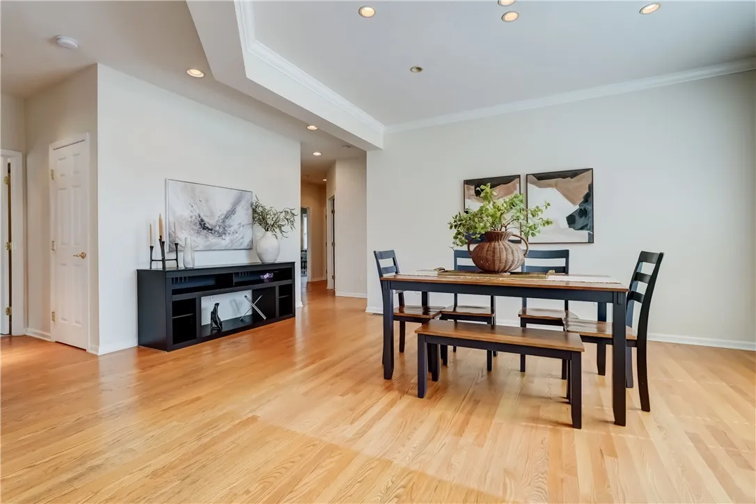 Dining room with a view to hallway for additional bedrooms, laundry and 2nd full bath.