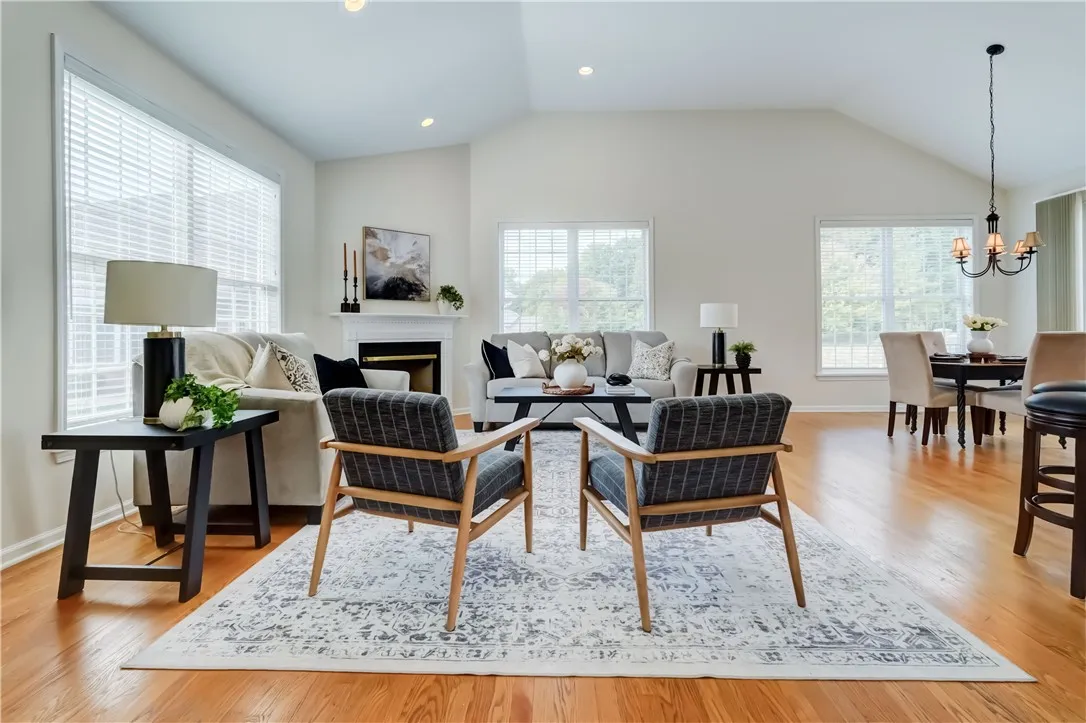 Light and bright great room with cathedral ceiling.