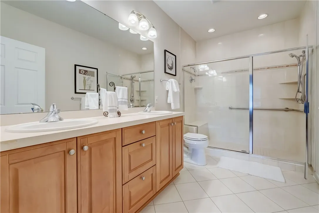 Primary bath with oversized tiled shower.