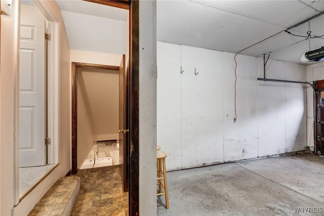 Garage on the right with the entry to basement fand kitchen.