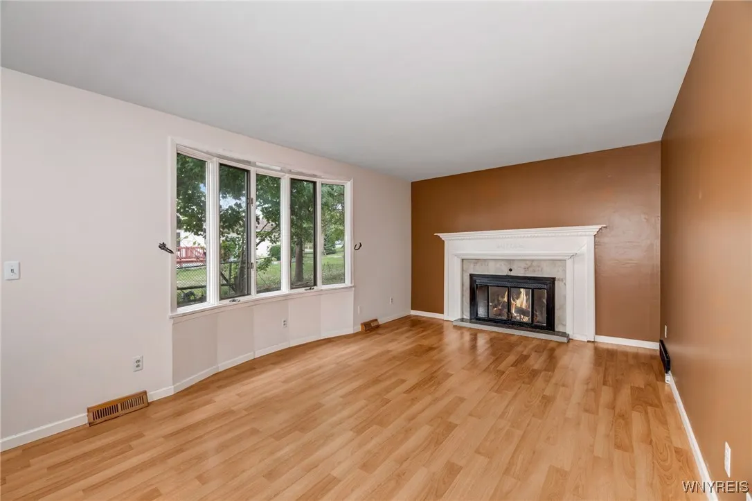 Center entrance.....living room is on the left and dining room is on the left.  Gas fireplace NRTC .