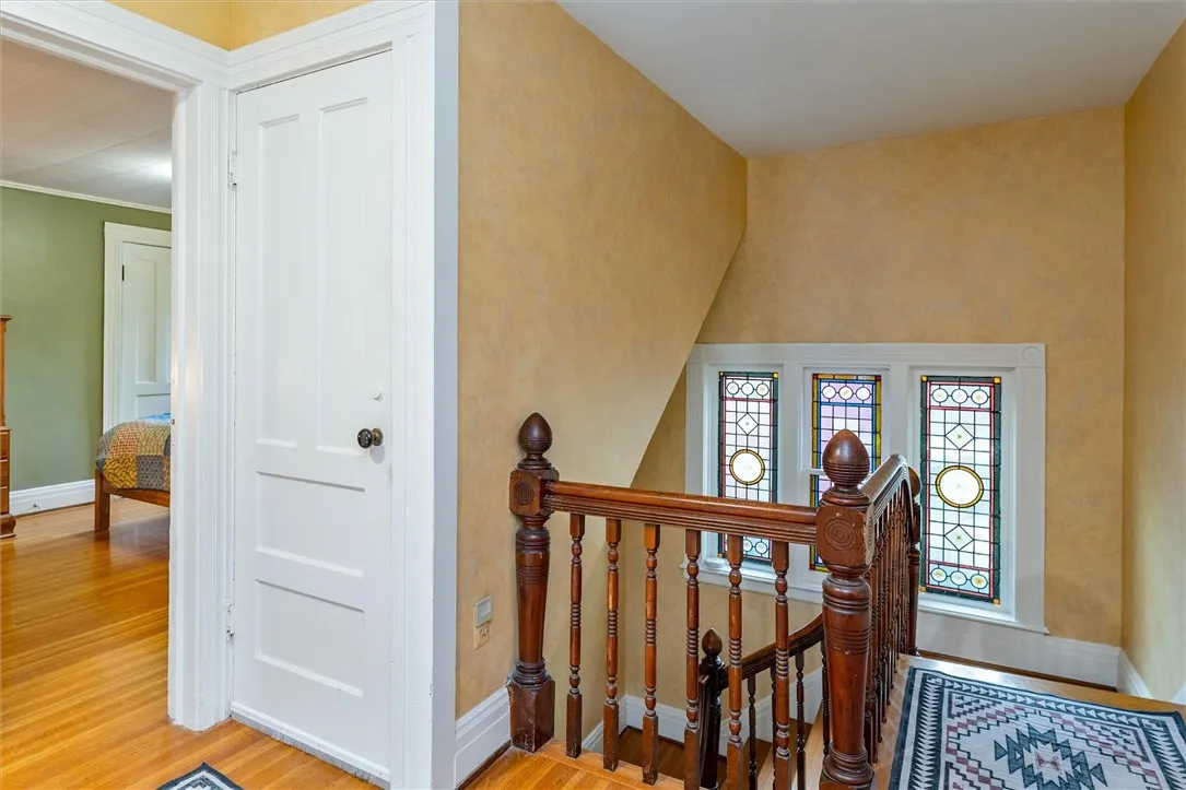 attic access and stained glass windows, large linen closet to right