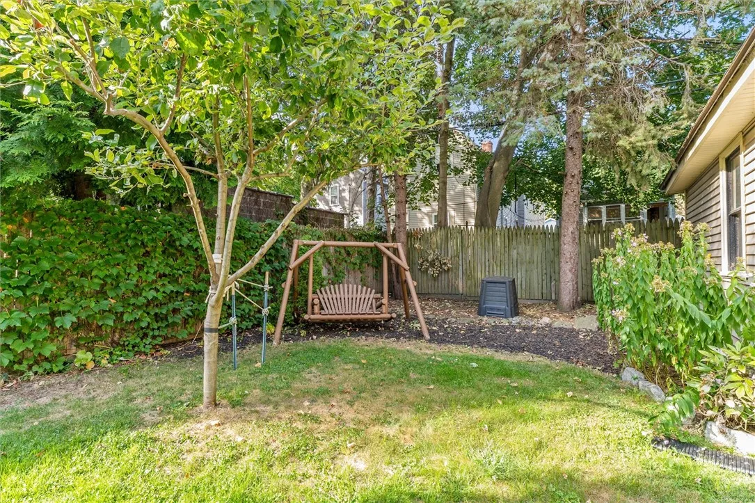 apple trees, swing and compost bin