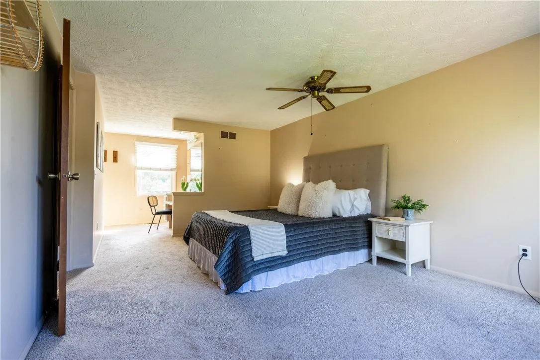 Primary bedroom with en suite bathroom, walk in closet