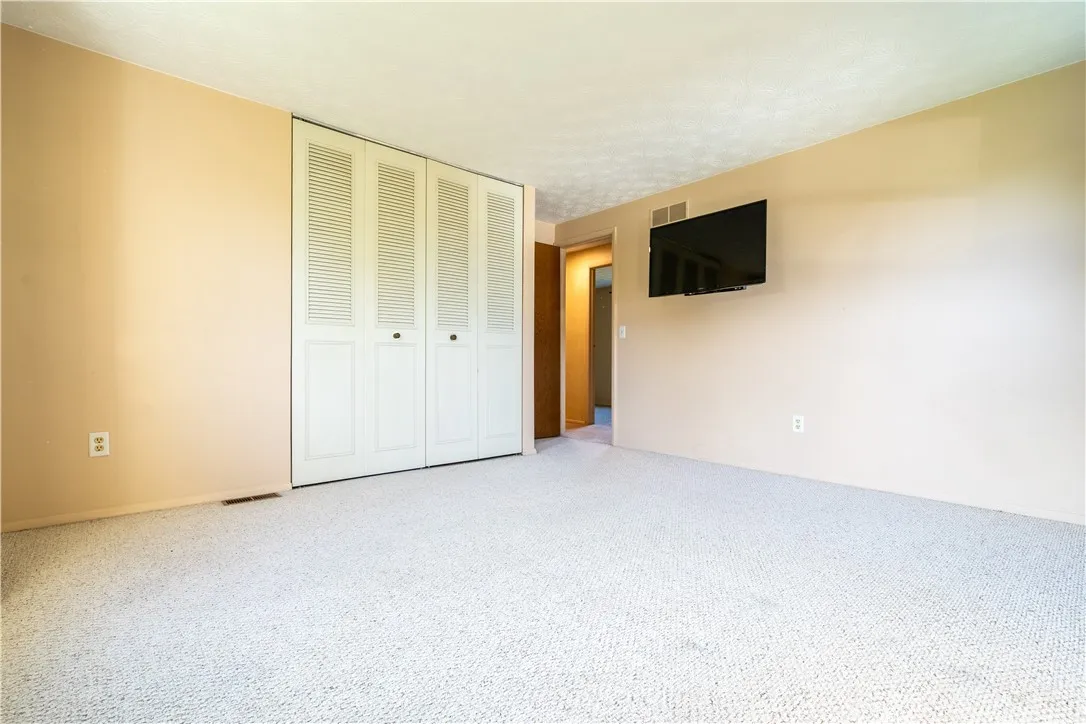 Third bedroom is very roomy and closet is very generously sized! TV and mount will stay!