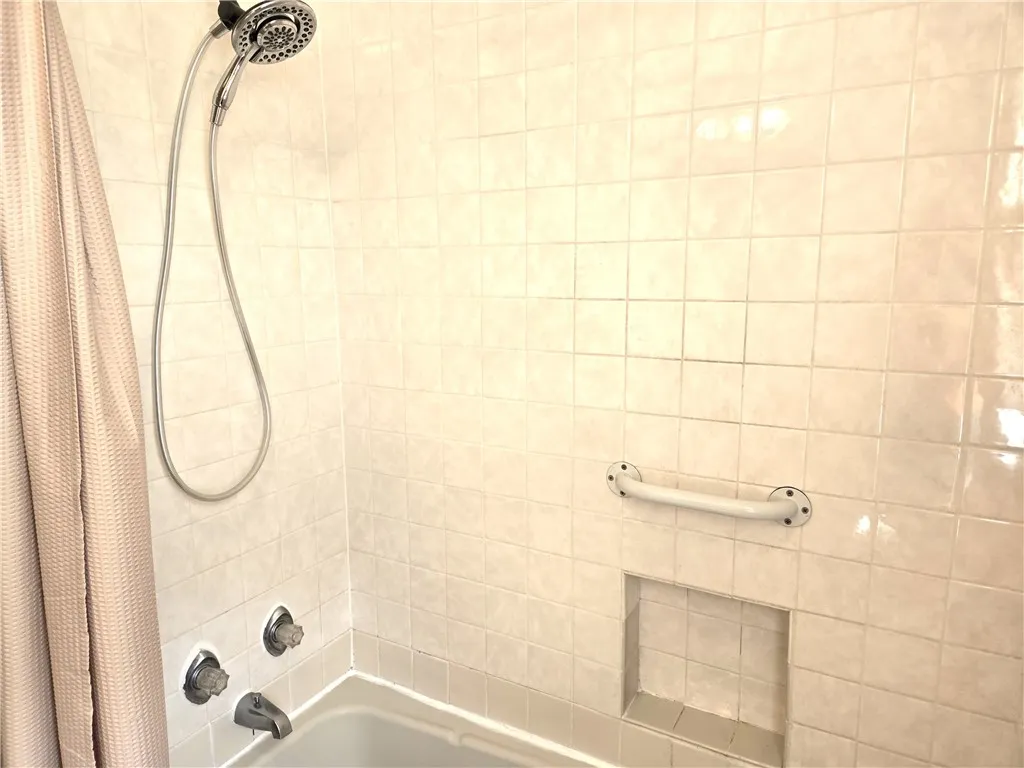 Tub shower in Full Bathroom