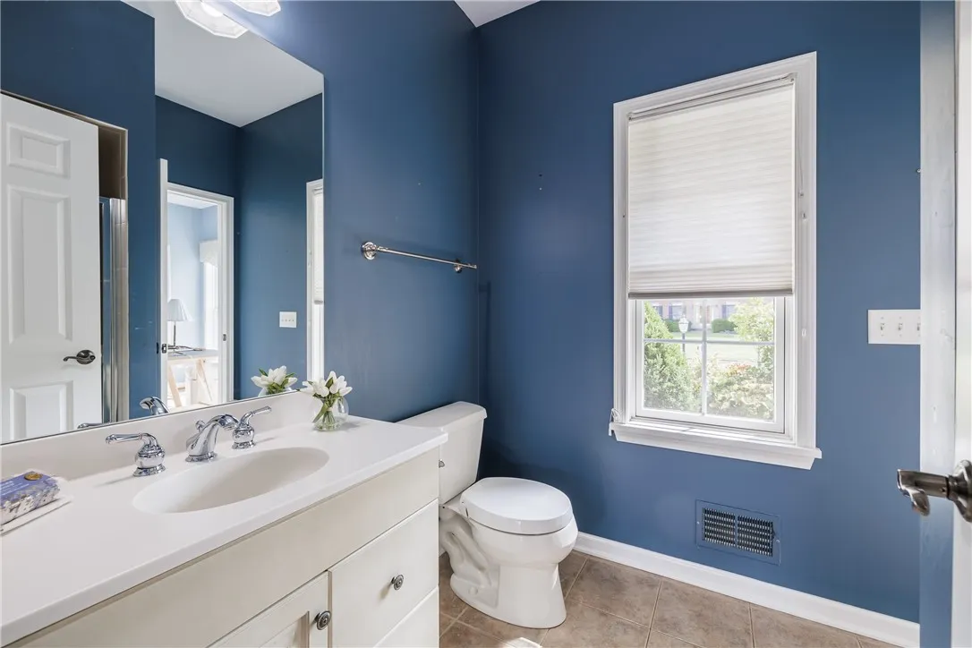 Full bath on main floor connected to office and back hallway.