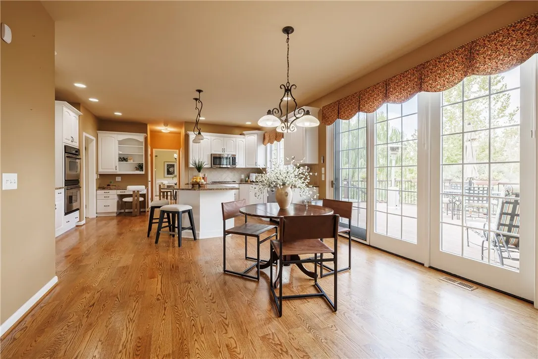 The kitchen is spacious so that there is always easy access to the deck without having to squeeze by the table!
