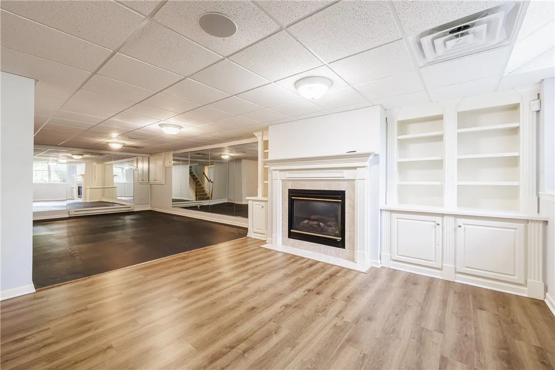 Professionally finished rec room in lower level includes built-ins and a gas fireplace!