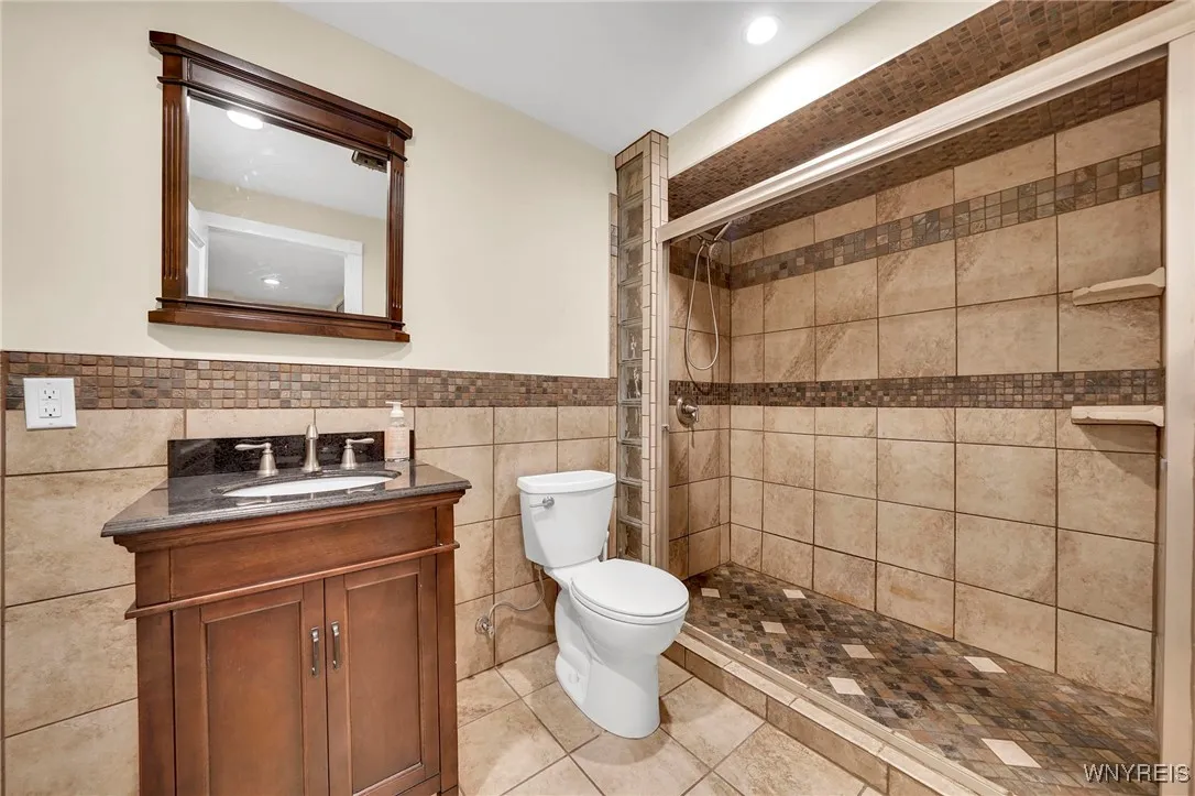 Gorgeous full-bath in basement. Check out that tile work in the walk-in shower.