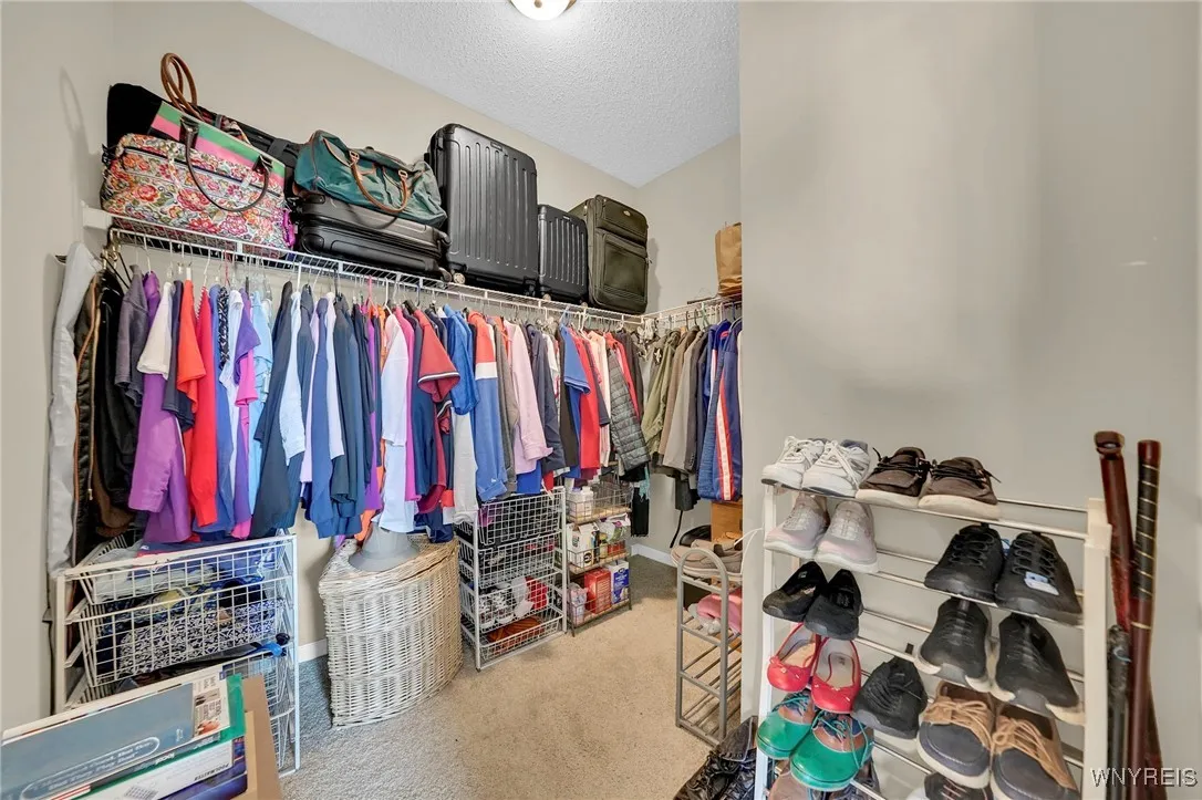 Walk-in closet in primary bedroom.