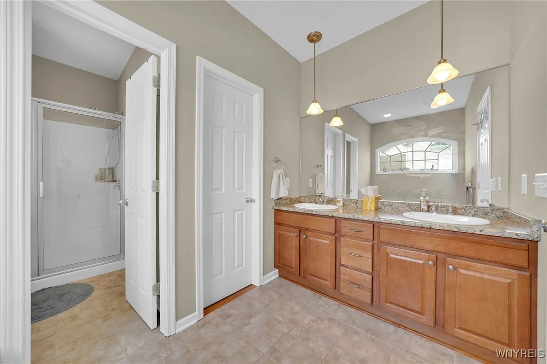 Double-sinks and walk-in shower.