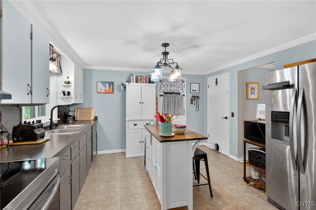 Here we can see the door in the corner that leads to the dry basement where the laundry area/utilities and vast storage space are found.
