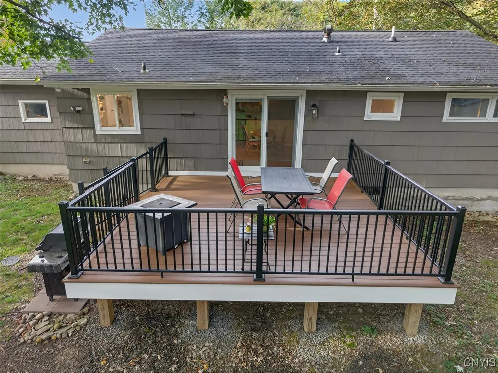 And NOW we can explore the spectacular exterior treats of this stellar property! To begin, the composite deck off the dining room will be the envy of your guests through the warm seasons!