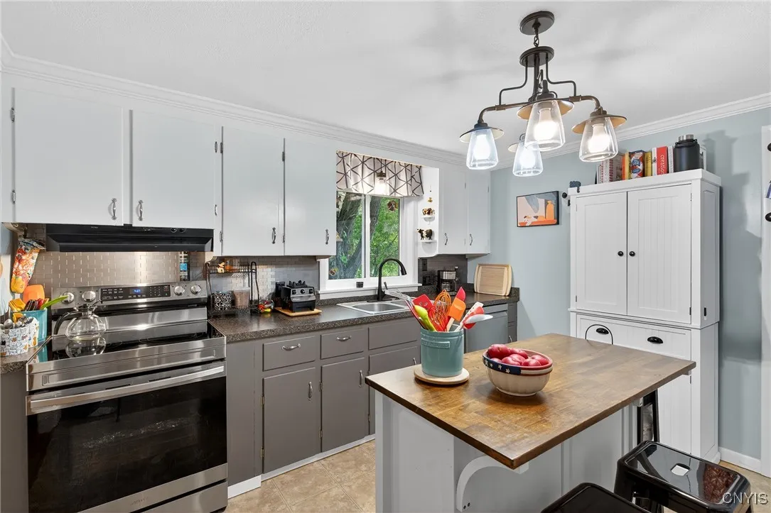 The electric stove was just purchased in 2023 but there is a gas line behind in the case that the new owner would rather have a gas range.