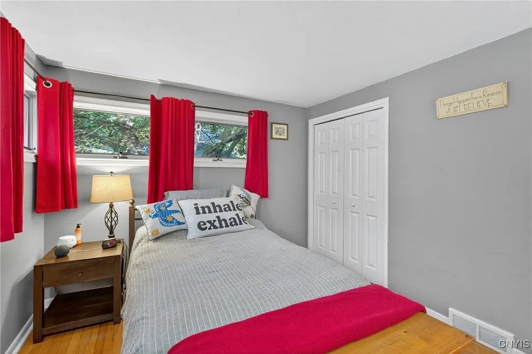 The double-door closet is at the corner - and don't forget there are more of the gleaming hardwood floors in this wing!