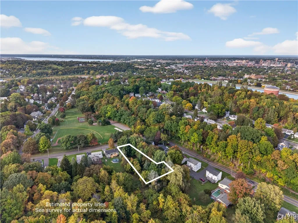 This bird's eye view provides a better understanding of just how far back the yard extends as you can see the lush trees that fill out the very back of the lot.