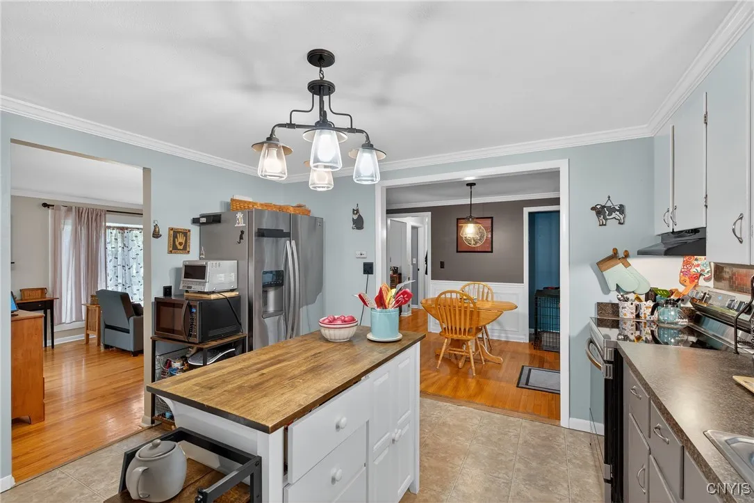 And now we head to the kitchen! Painted in a celestial hue, this airy space will be a delight for your culinary adventures!