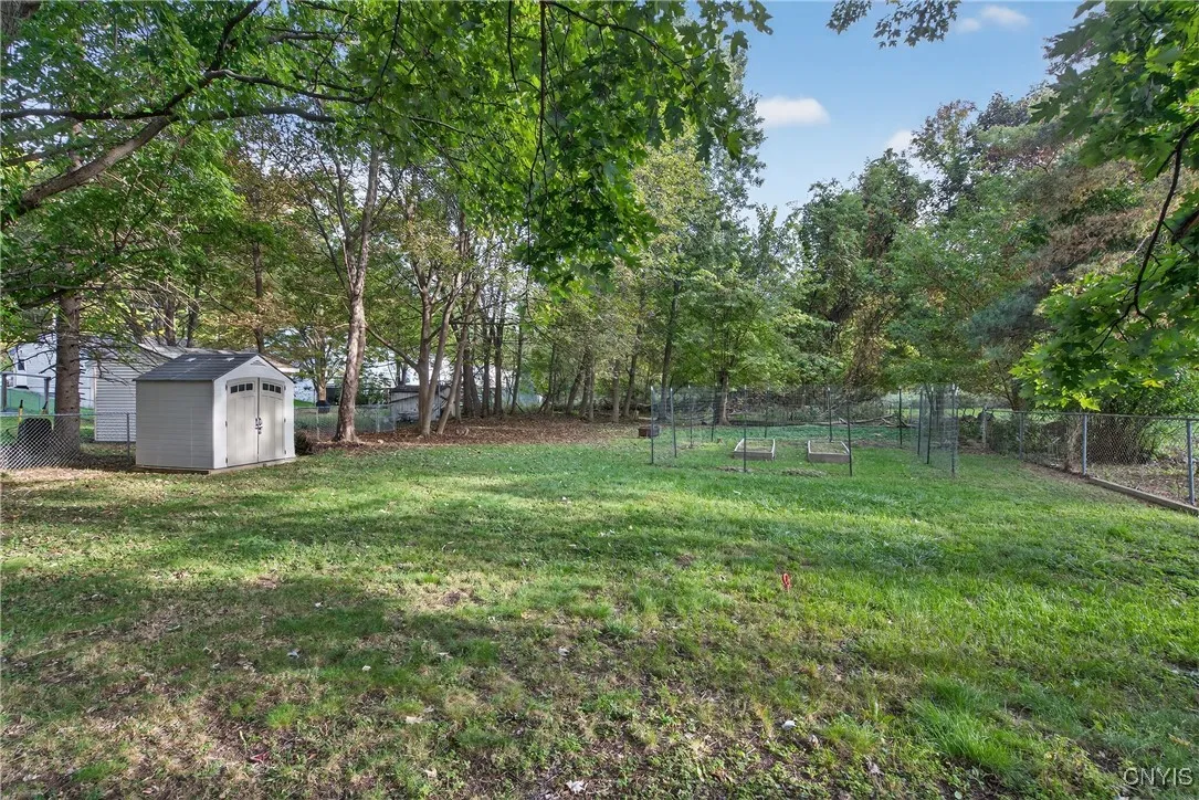 This deep yard extends beyond the trees seen in the distance as the lot is .38 acres!