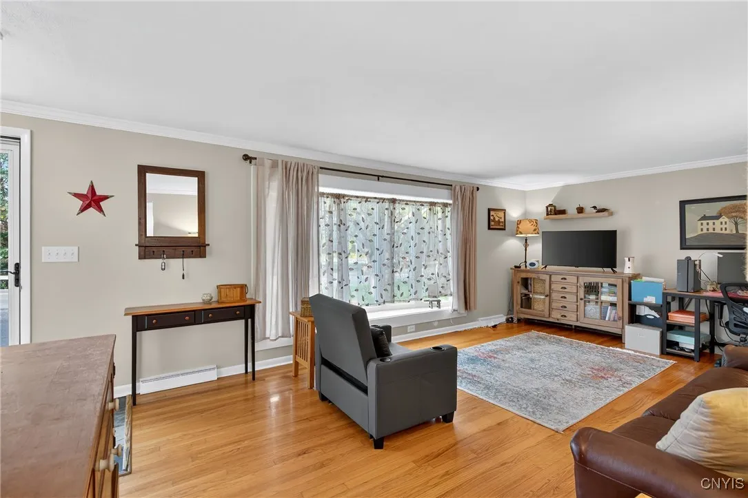 Turning our perspective, we now see how the newer bay window allows glorious natural light to pour in!