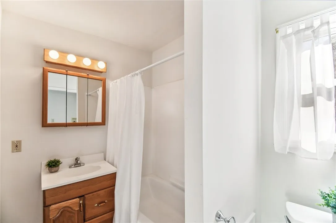 THE REMODELED BATHROOM.
