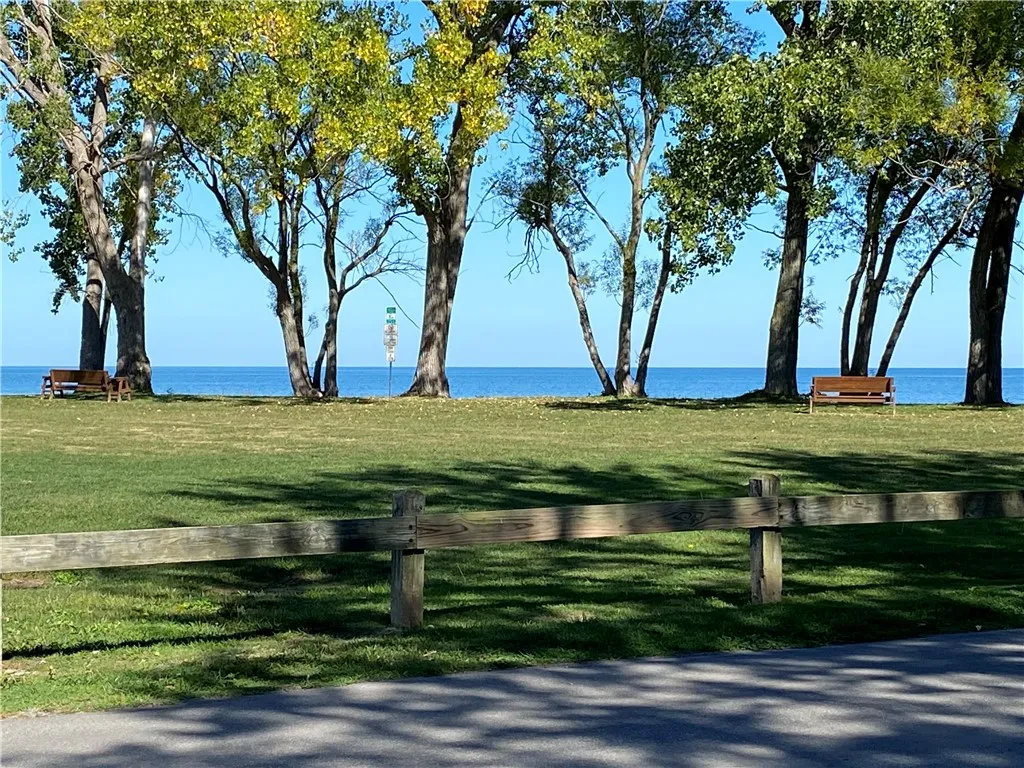 RIGHT AT THE END OF THE STREET IS A BEAUTIFUL TREED PARK AT THE SHORE OF LAKE ONTARIO.