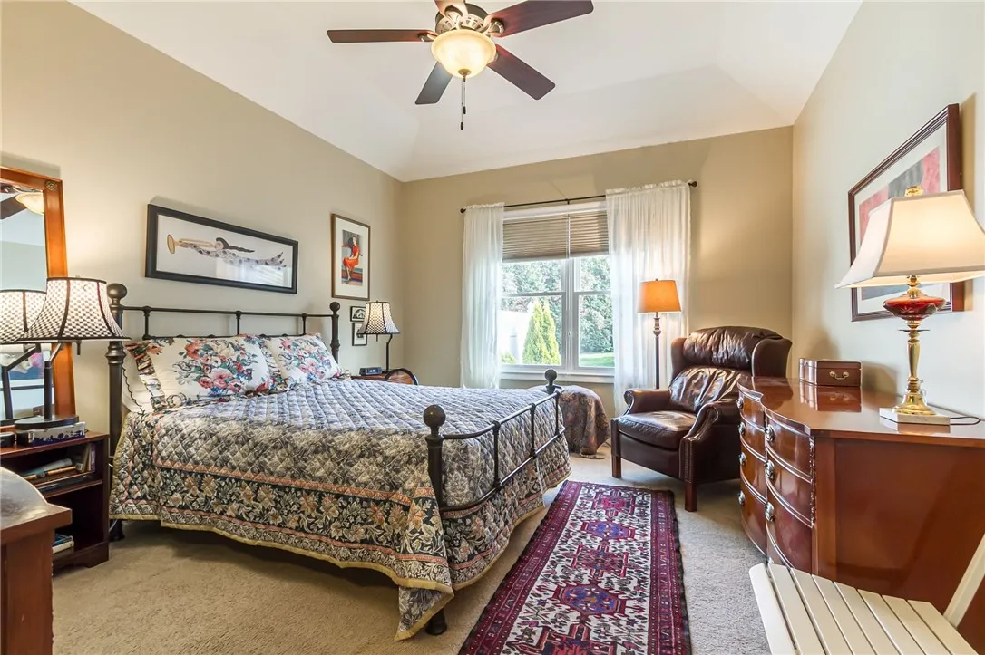 Lovely Primary suite overlooks private rear yard.