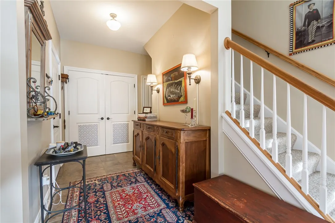 Pretty & welcoming Garage, Guest closet and Laundry entry!