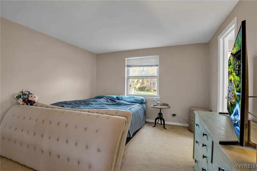 Primary bedroom with half bath.