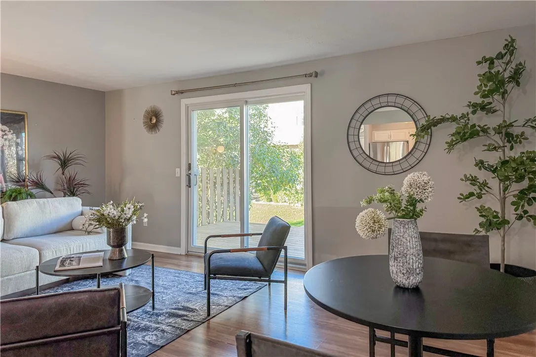 Open plan living/dining showing door to deck