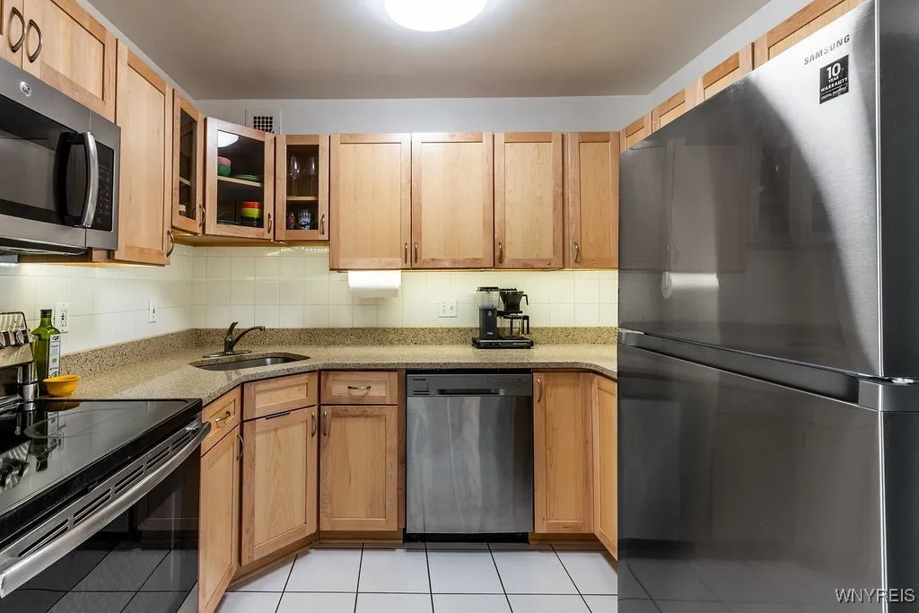 Newer stainless steel appliances, maple cabinetry and solid terrazzo counter​​‌​​​​‌​​‌‌​‌‌​​​‌‌​‌​‌​‌​​​‌​​ tops