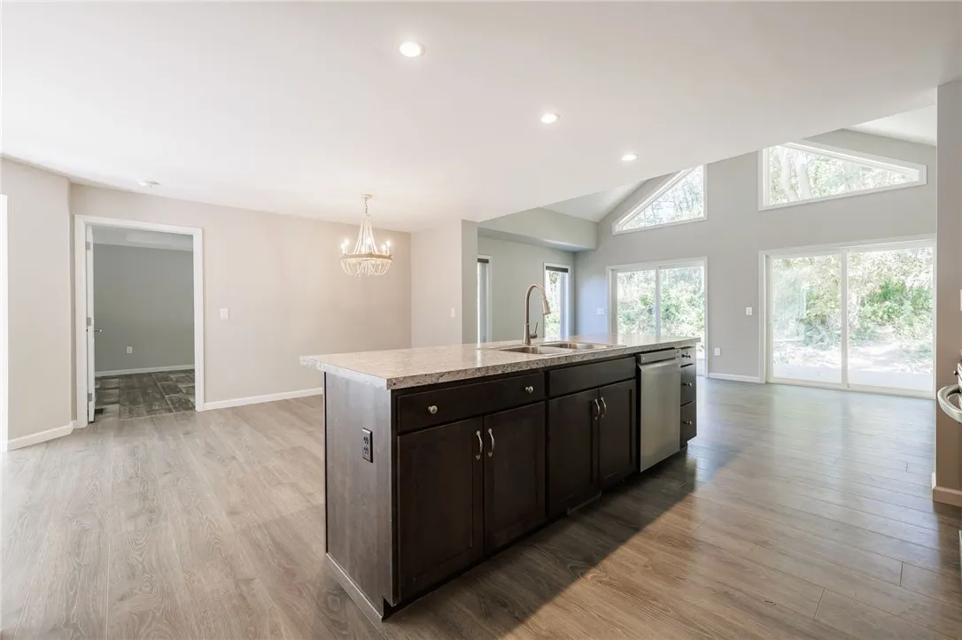 View of KitchenIsland to Greatroom with views of backyard