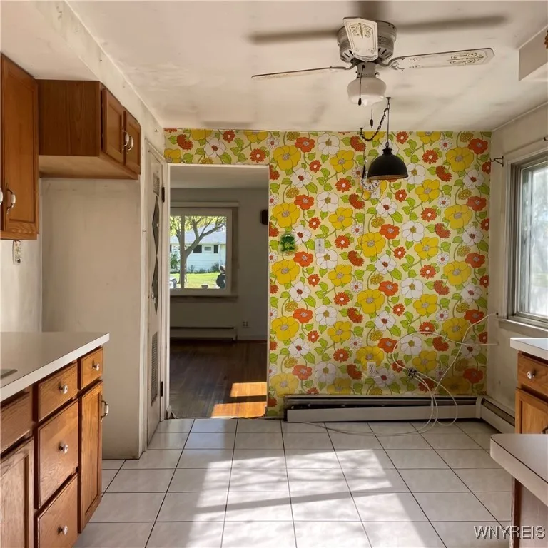 Kitchen is large enough for table.
