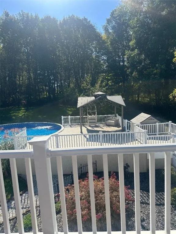 deck off primary suite with view of back​​‌​​​​‌​​‌‌​‌‌​​​‌‌​‌​‌​‌​​​‌​​ yard