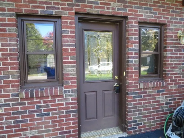 Beautiful entry door to the 3 car garage...