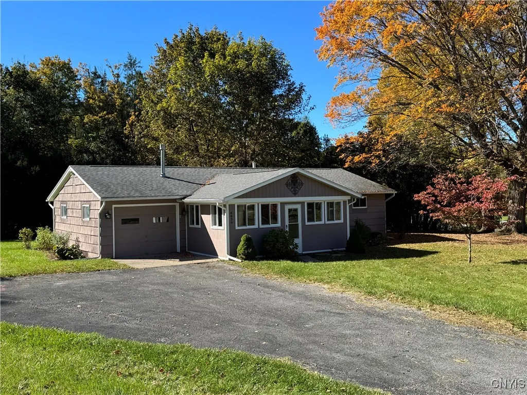 Home sits on a lovely tree lined lot.