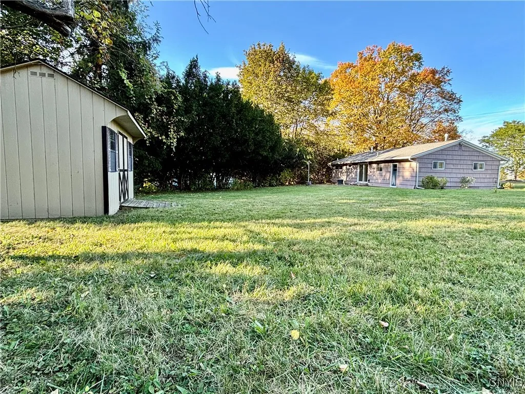Newer storage shed at back of property