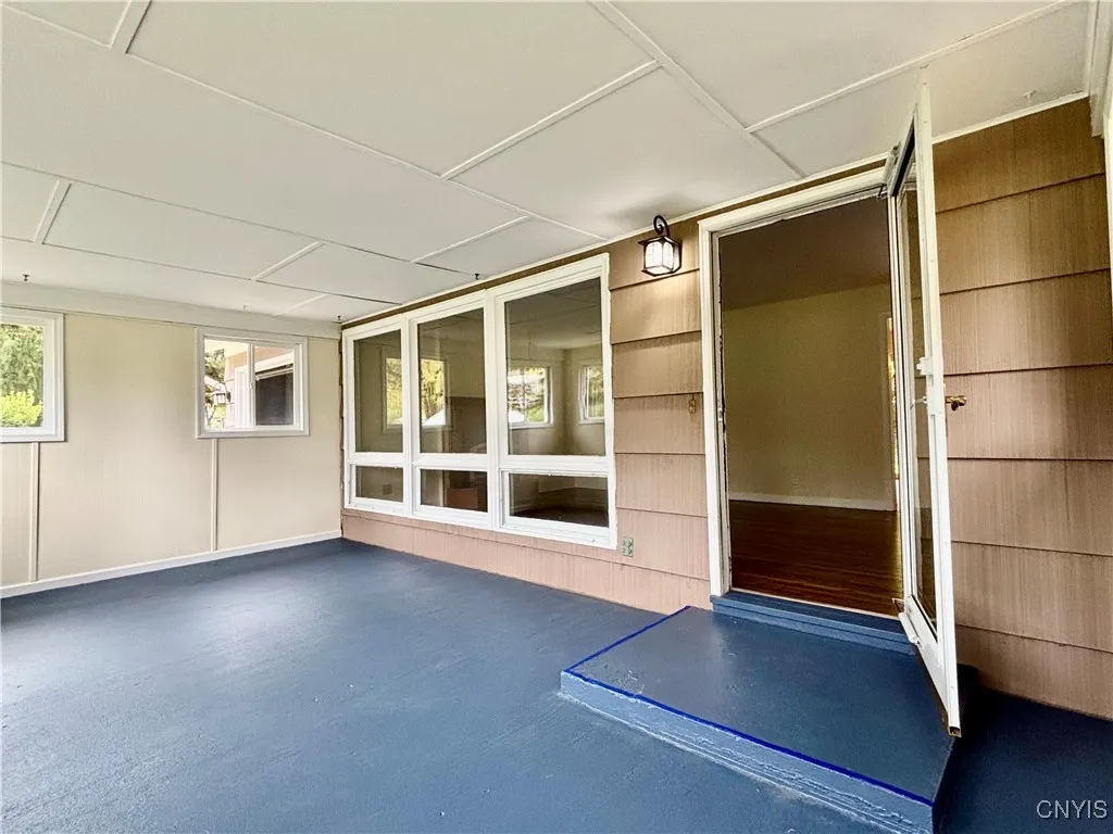 Entering home through the inviting 3 Season front porch.