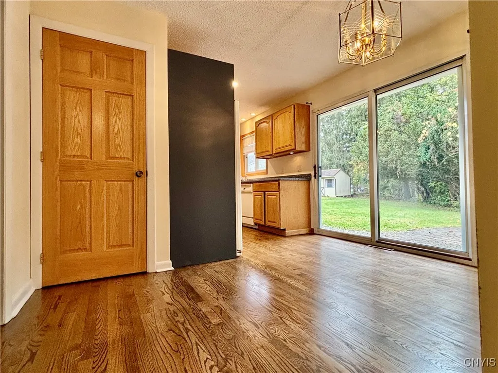 Sliders step out to backyard and patio.