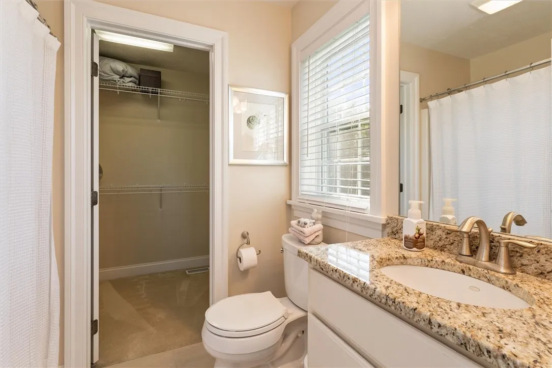 Guest Bedroom Suite- features it\'s own en suite bath and walk-in closet on opposite side of house for added privacy.