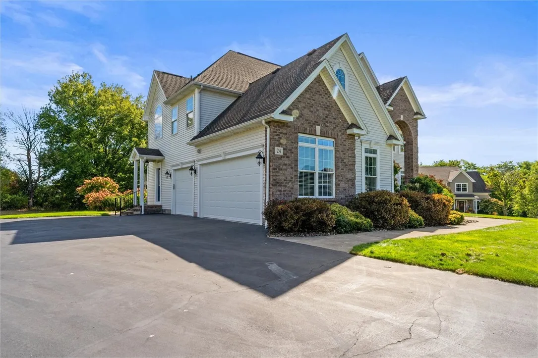 Style meets function! Gorgeous brick-front exterior with side entrance, generous parking space, and a 3-car garage for all your needs.