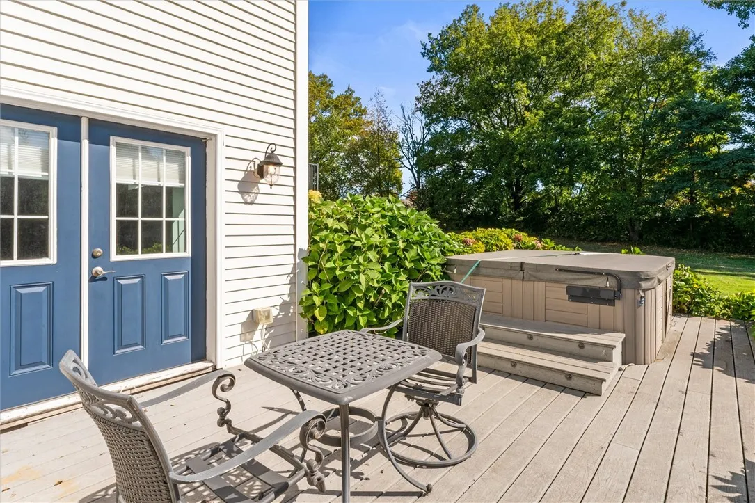 Relax and unwind! The hot tub offers the perfect retreat and is conveniently accessed from the walk-out lower level—ideal for year-round enjoyment.