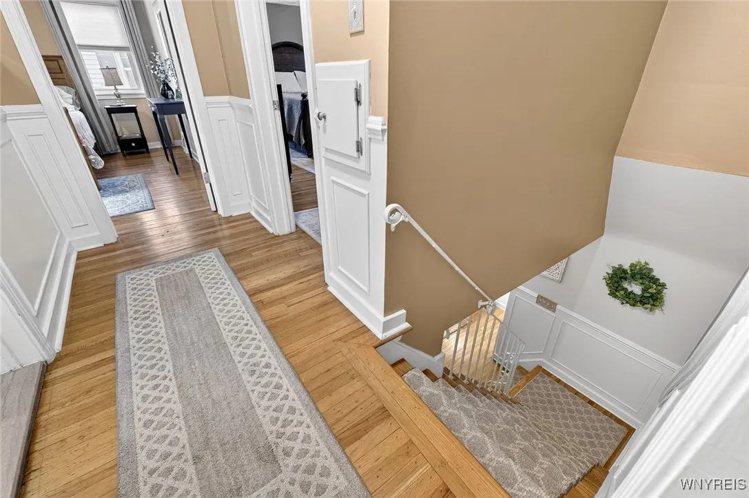 Hardwood staircase & hallway - chair molds dress up the staircase and upper hallway. Classic!