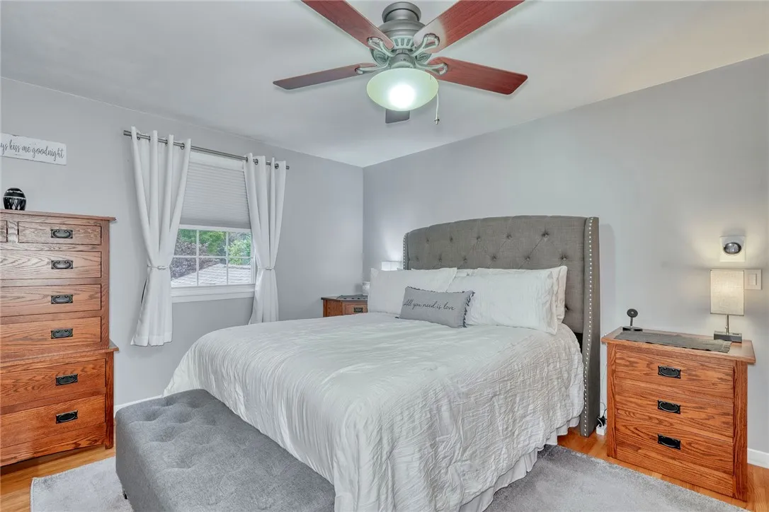 Primary bedroom with ceiling fan